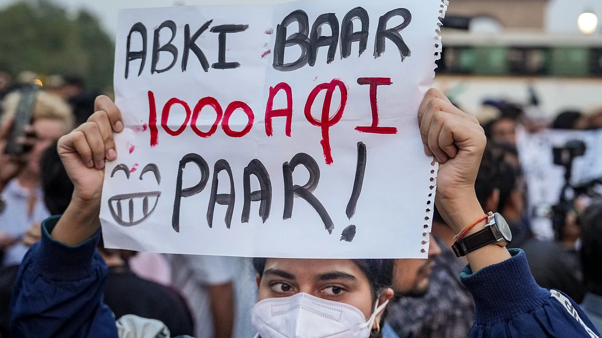 A protester holds a placard at a rally against Delhi’s worsening air quality.
