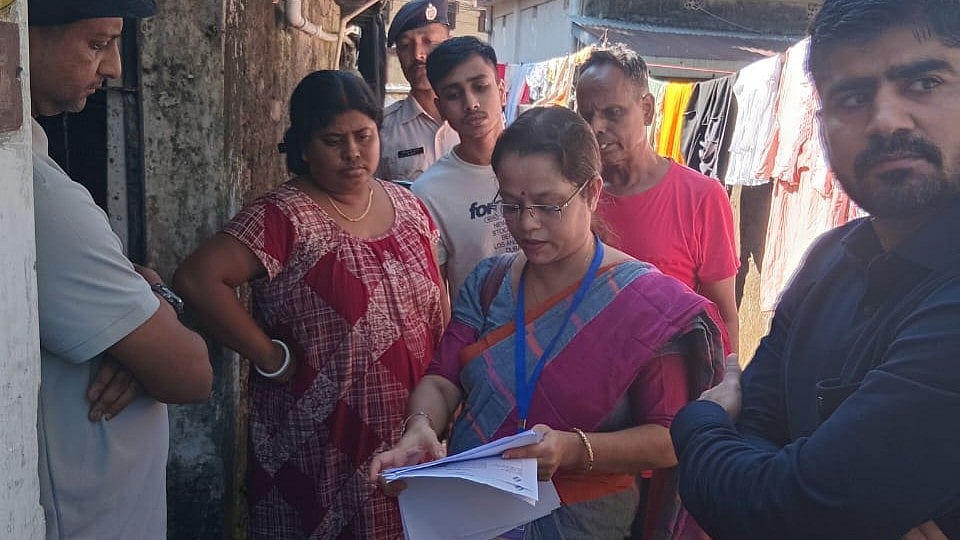A BLO distributes enumeration forms in Siliguri.