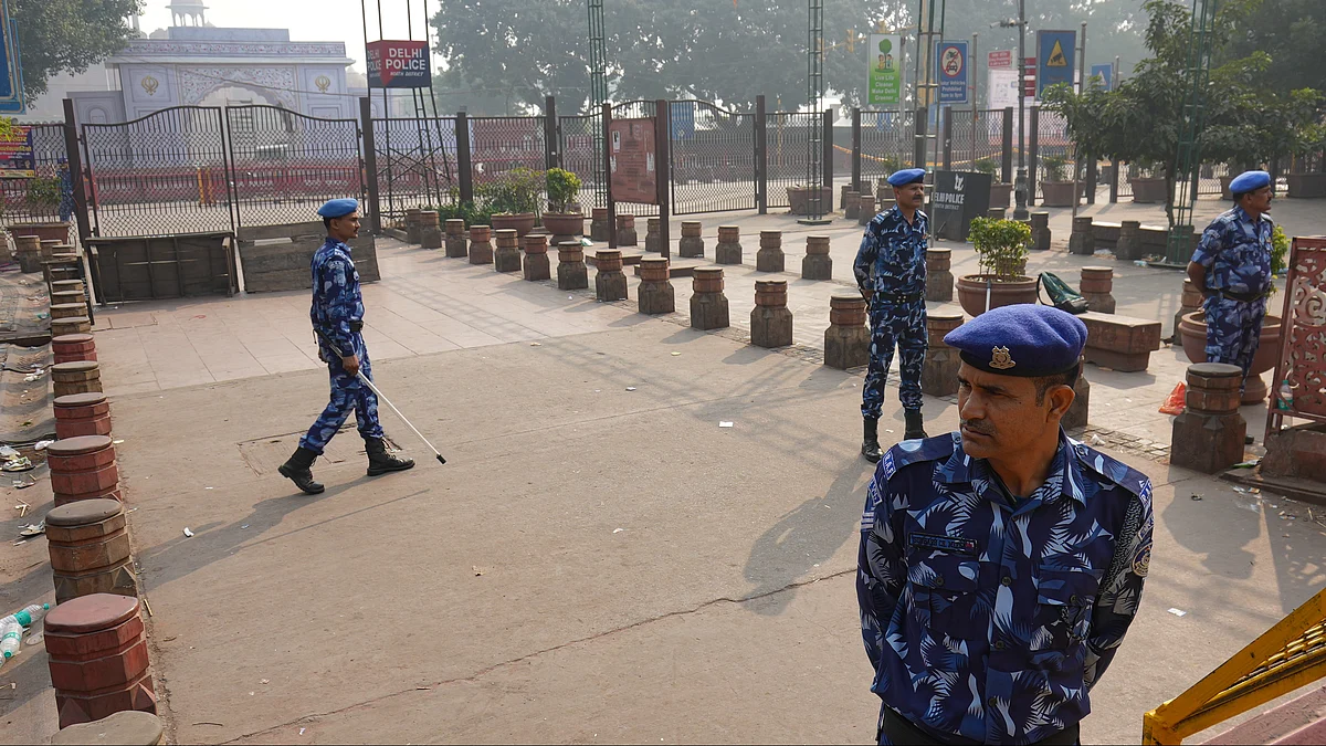 Security personnel stand guard at the Red Fort blast site.