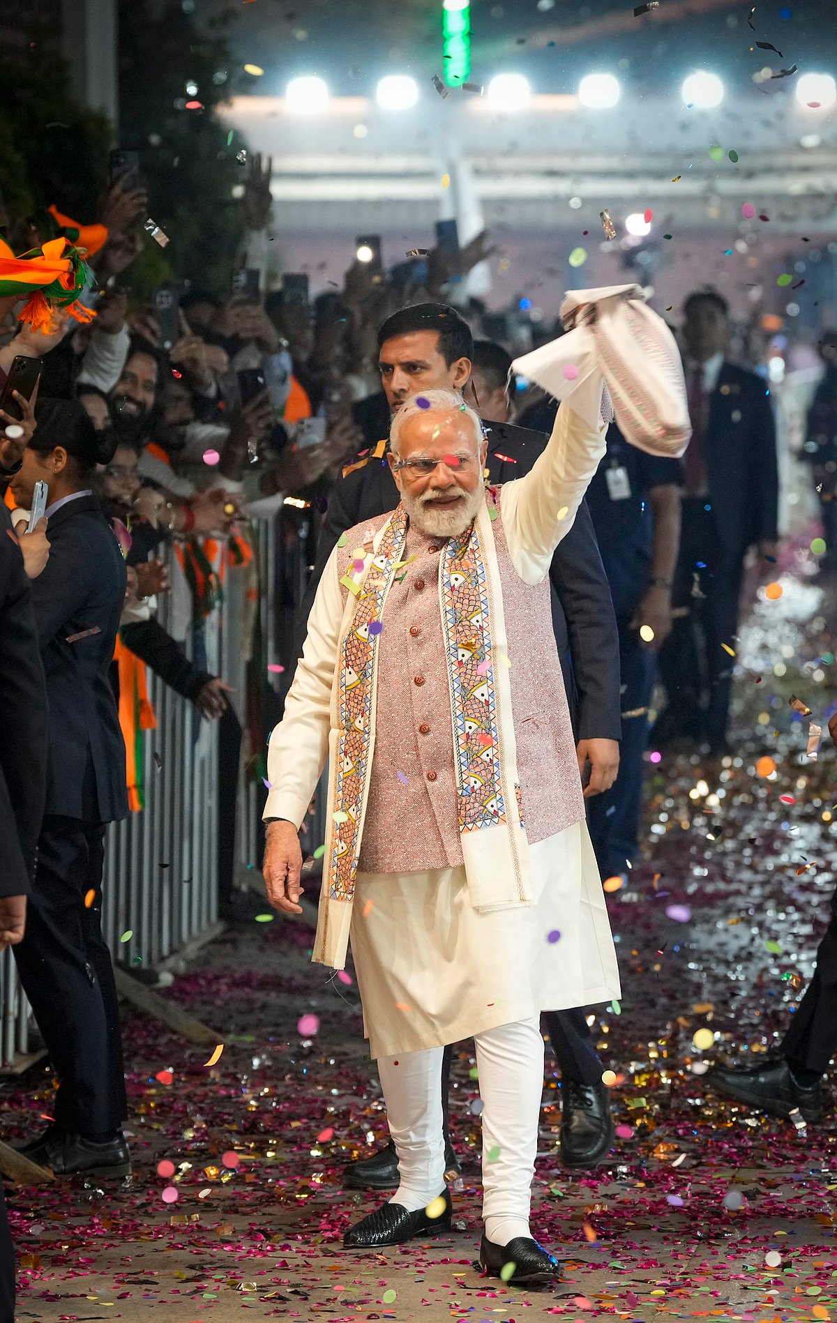 PM Narendra Modi waves a 'gamcha' as he arrives at the celebration of NDA's victory, at BJP HQ, New Delhi