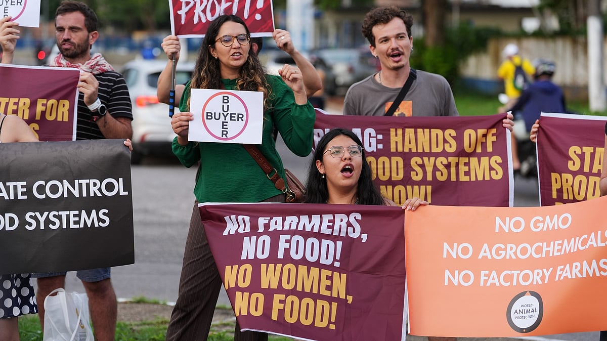 Demonstrators protest against big agribusiness outside the venue for the COP30 U.N. Climate Summit