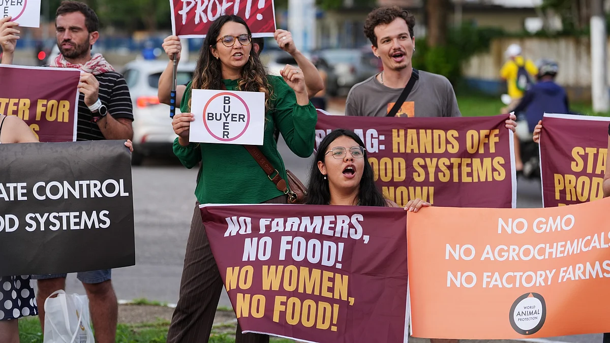 Demonstrators protest against big agribusiness outside the venue for the COP30 U.N. Climate Summit