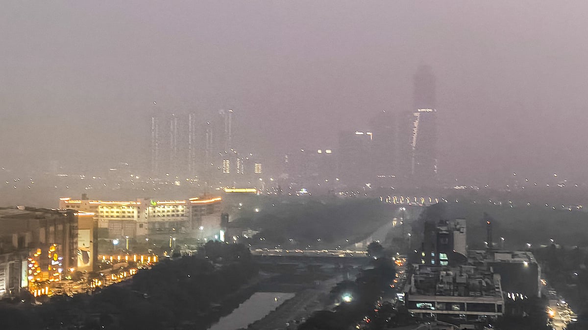 Aerial view shows Noida’s skyline swallowed by thick smog.