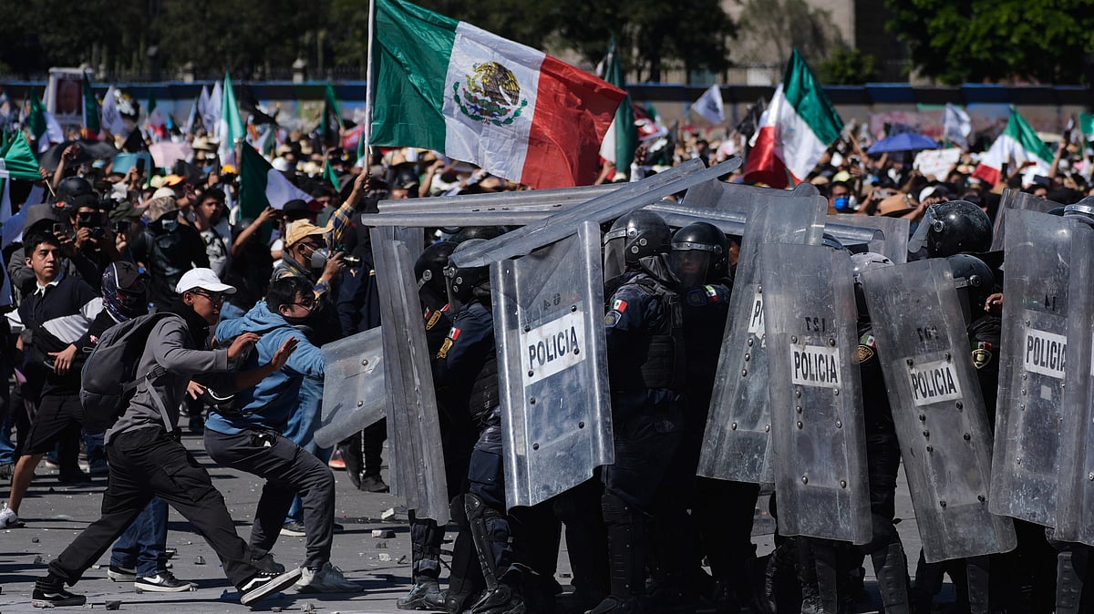 Protesters clash with police during a youth-led anti-government march in Mexico City.