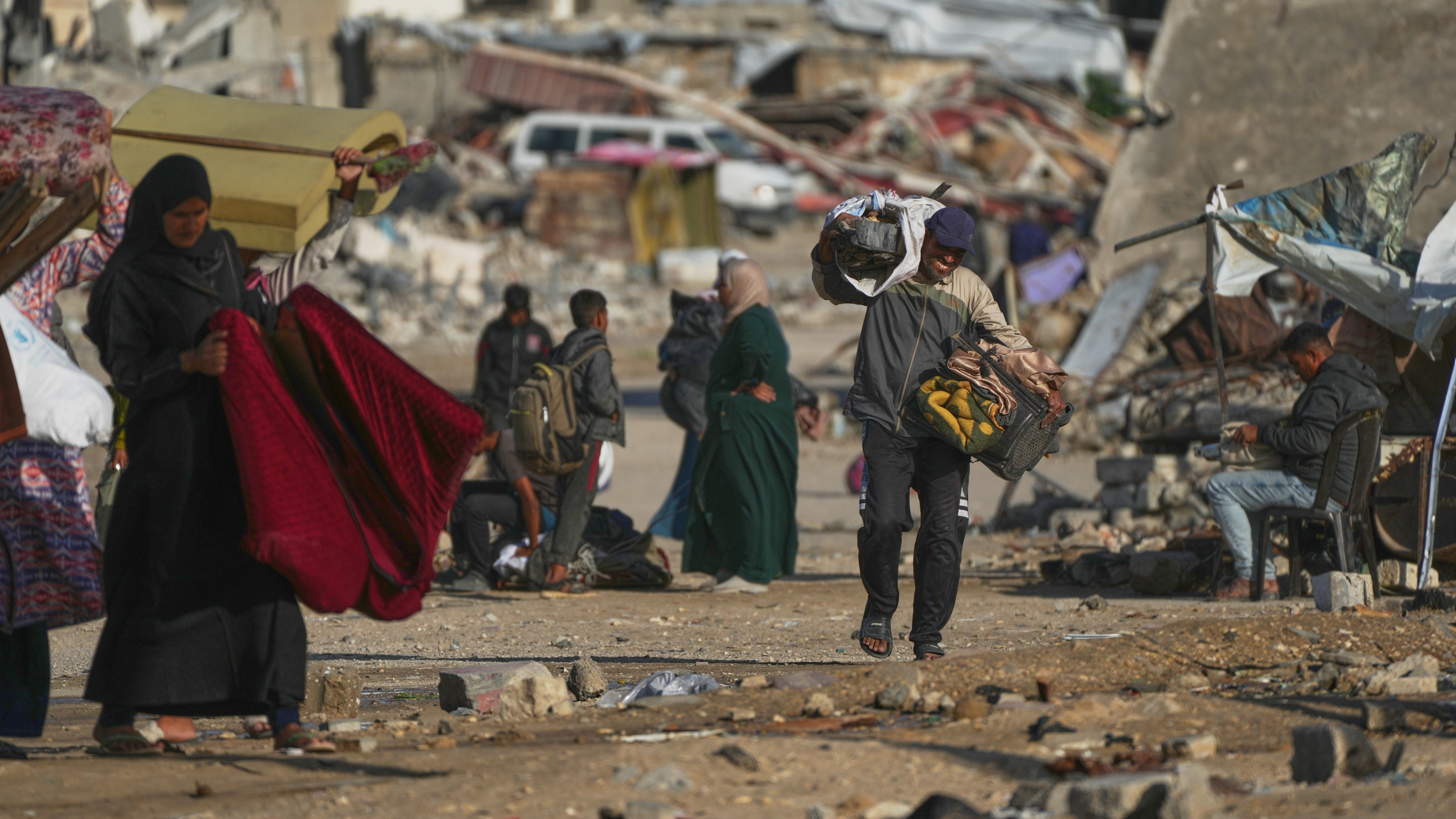 A man gathers firewood from rubbish to survive the deepening winter in southern Gaza.