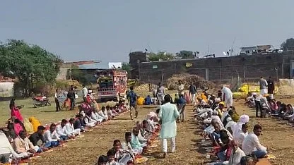 Villagers gather at the money's cremation