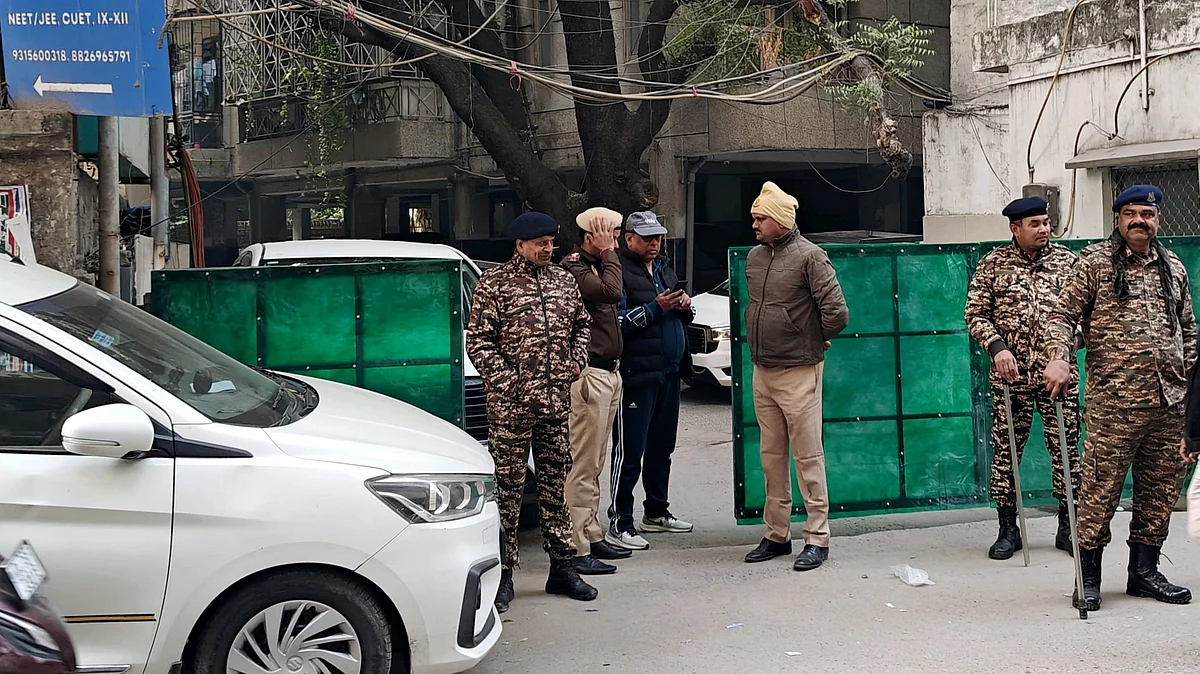 Security personnel stand guard following ED raid at Al Falah University’s Delhi office in Okhla.