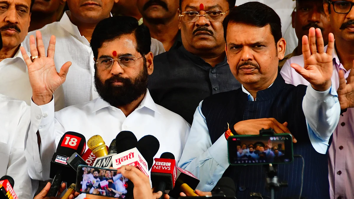 In this photo from Nov 2023, CM Shinde (L) and deputy CM Fadnavis speak to the press in Mumbai