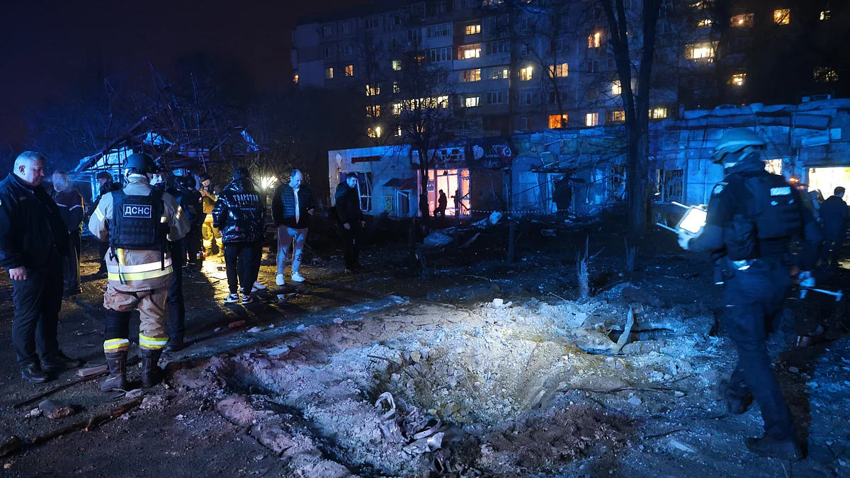 A gaping crater marks the ruins of a Zaporizhzhia market after a Russian airstrike.