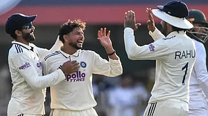 Kuldeep Yadav celebrates one of his three wickets on Saturday