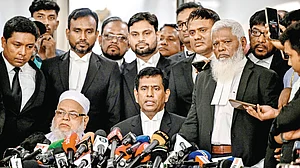 Chief prosecutor of Bangladesh’s ICT Md Tajul Islam (C) addresses media in Dhaka