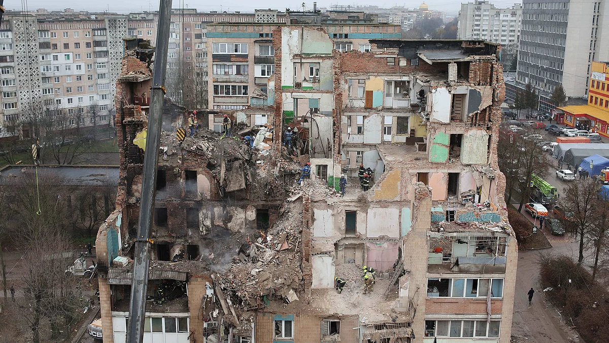 Rescuers clear the rubble of a residential building which was damaged by a Russian strike on Ternopil.