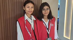 Trishapurna Das (right) and Fwjwngshri Swargiary, two young Garg fans at Barsapara Stadium.