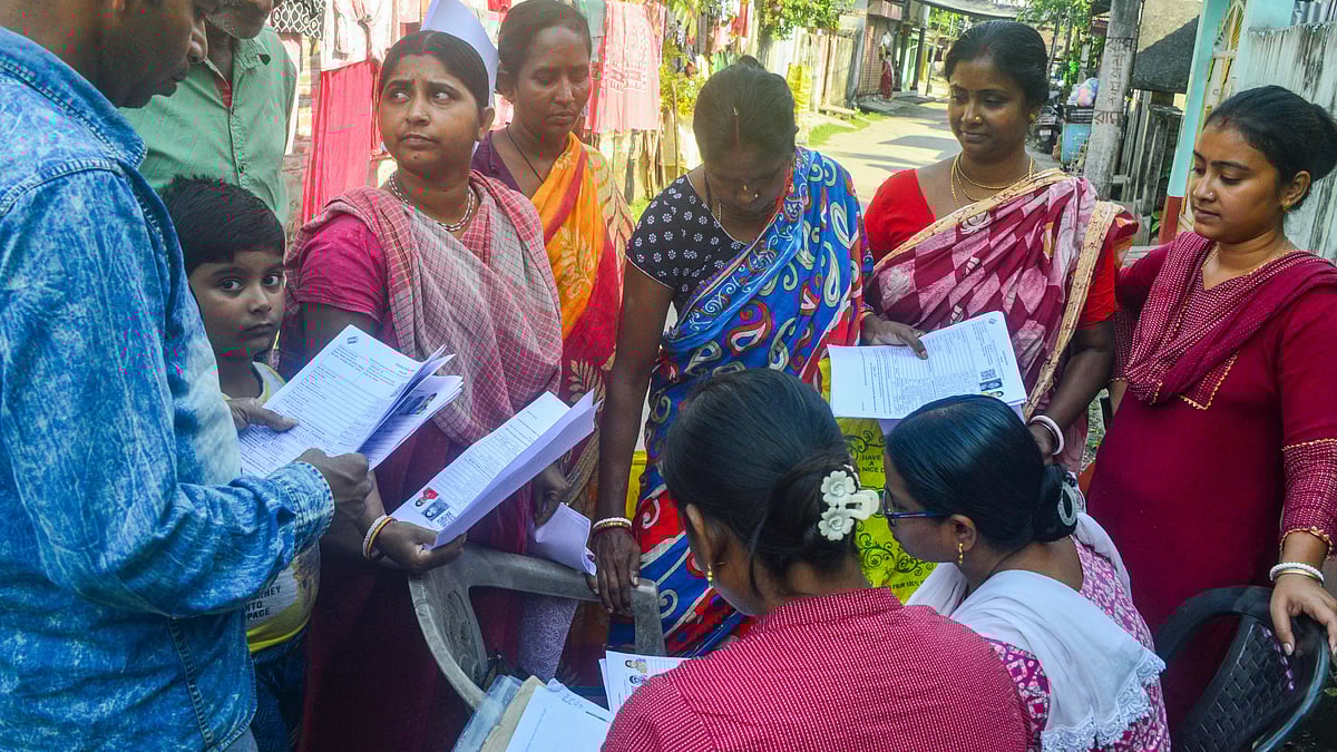 BLOs check and collect enumeration forms in Siliguri.