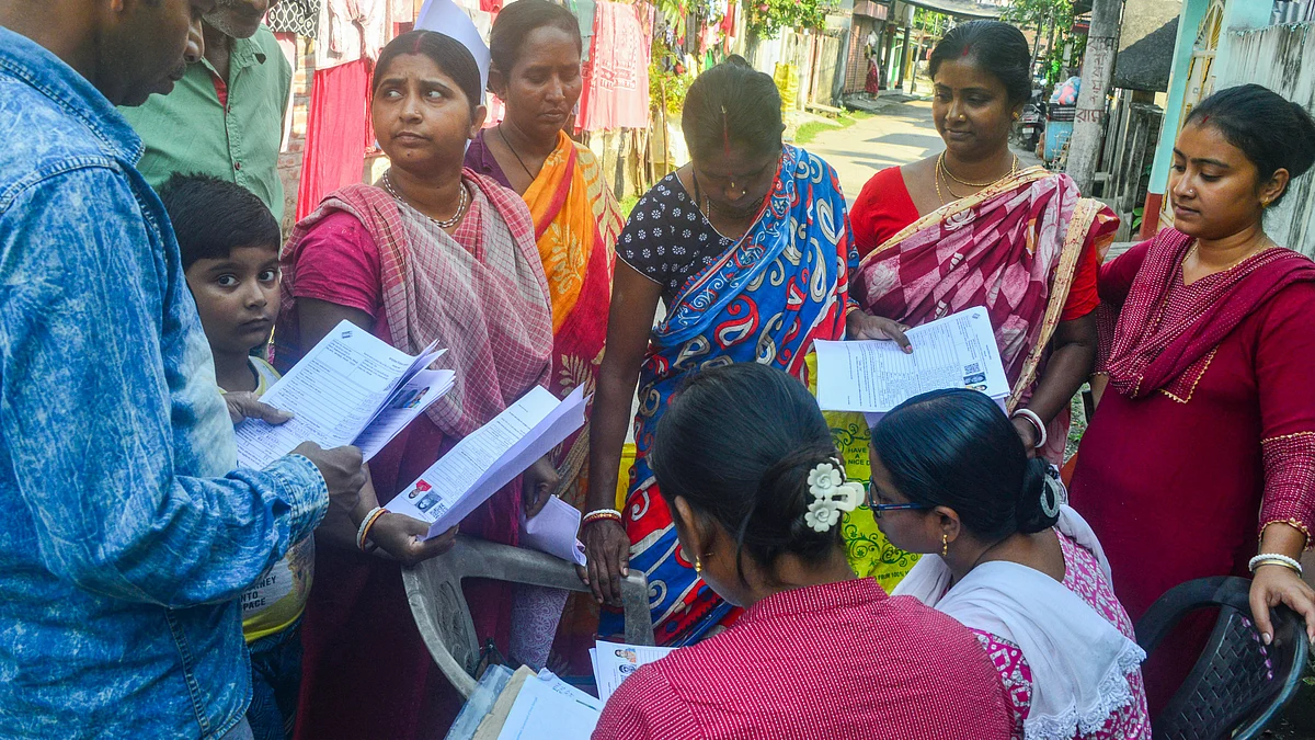 BLOs check and collect enumeration forms in Siliguri.