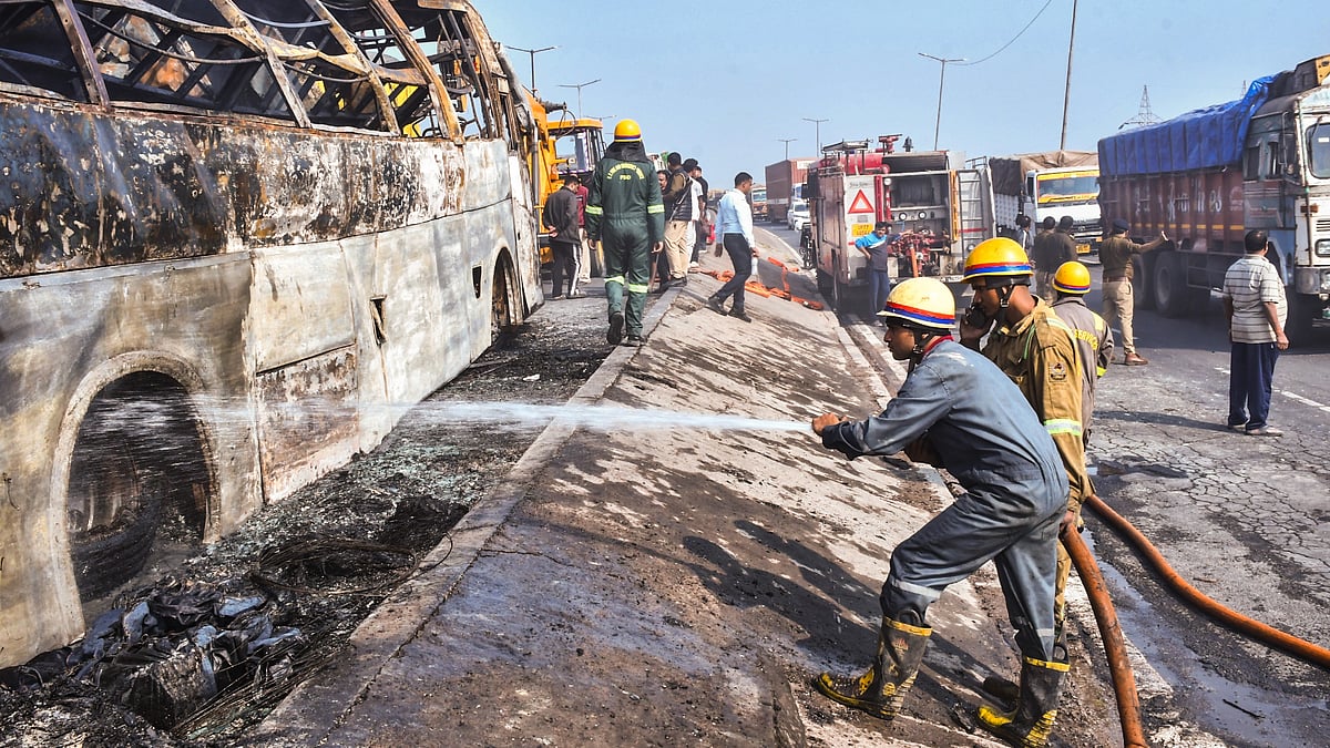 Firefighters battle flames after a bus erupts in fire near Ramadevi intersection in Kanpur.