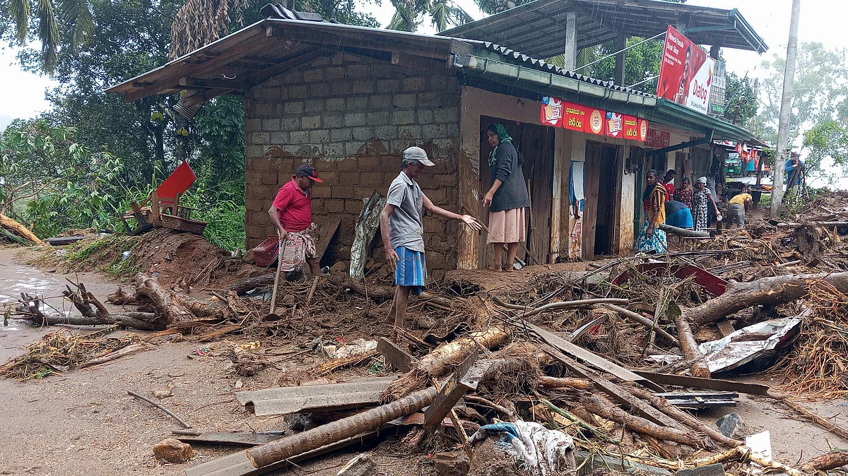 Survivors clear landslide debris in Hanguranketha, Sri Lanka.