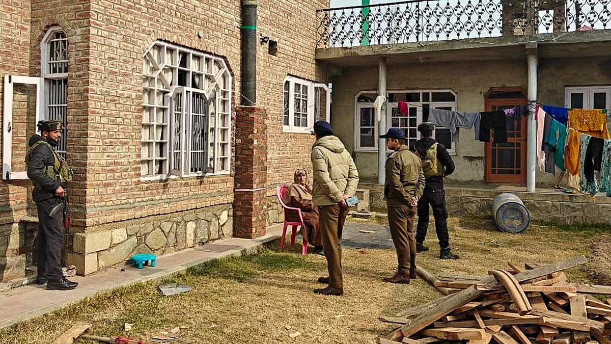 Police with CRPF personnel carry out search operation in Pulwama.