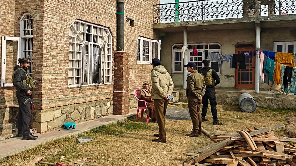 Police with CRPF personnel carry out search operation in Pulwama.