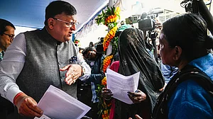 West Bengal CEO Manoj Kumar Agarwal with electors at an SIR camp, in Kolkata