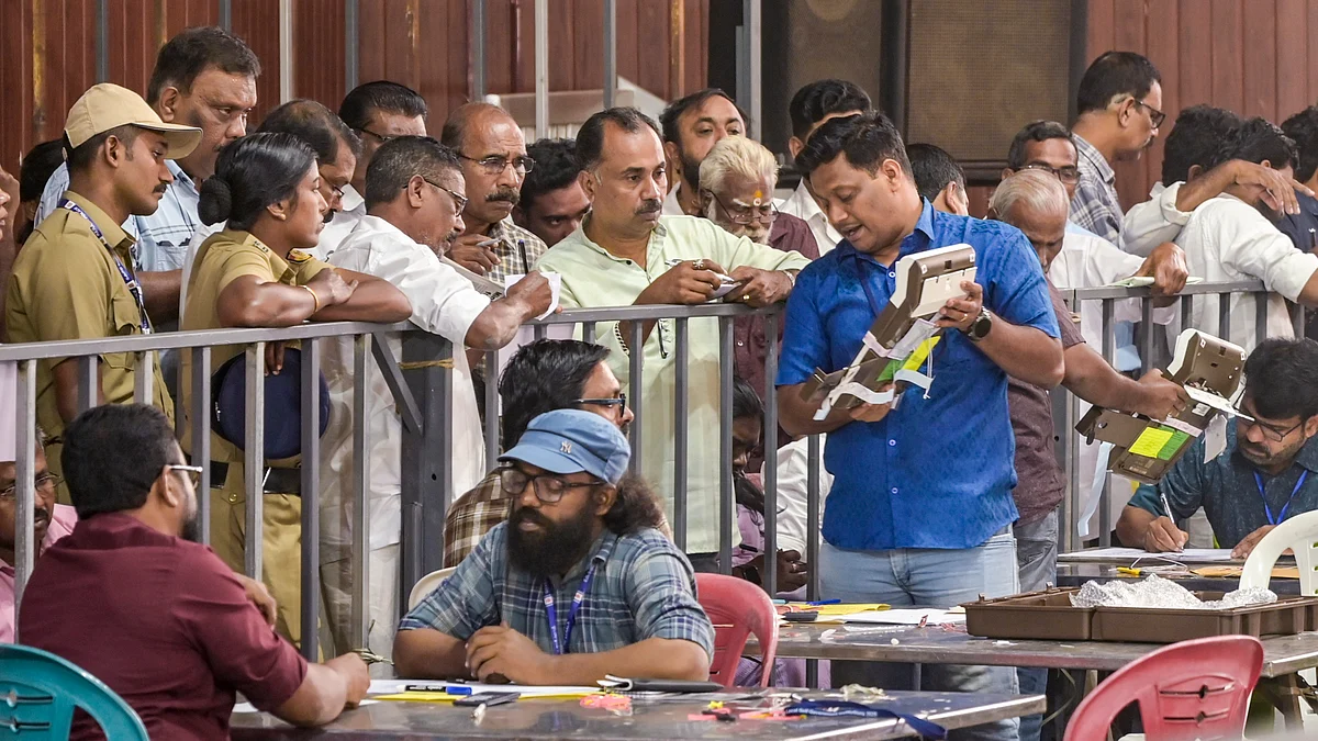 Political party workers witness counting of votes for Kerala local body elections, in Thiruvananthapuram.