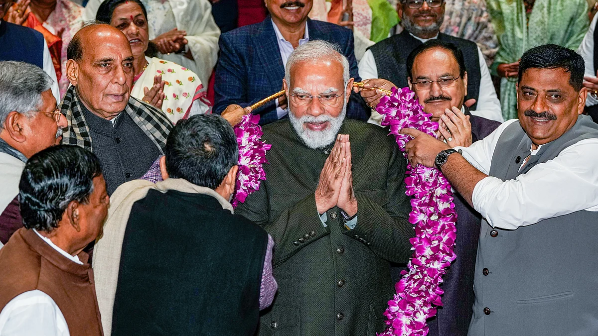PM Narendra Modi being felicitated at the NDA parliamentary party meeting, 9 Dec