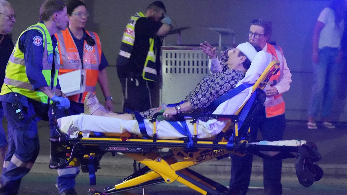 Emergency workers transport an injured person after the shooting