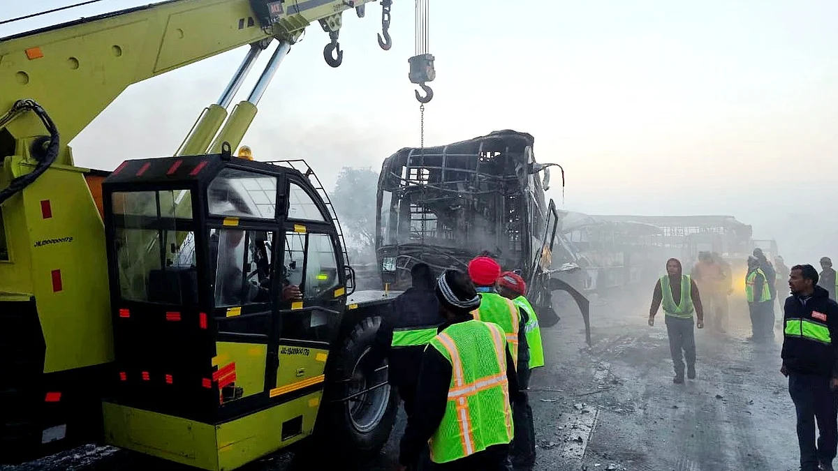 Damaged vehicles lie strewn along the Yamuna Expressway.