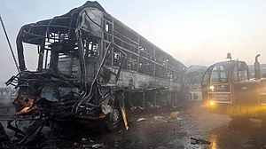 The charred vehicles on Yamuna Expressway after the accident on 16 December (Photo: PTI)