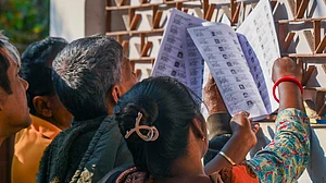Voters check their names in West Bengal's draft electoral rolls following SIR.