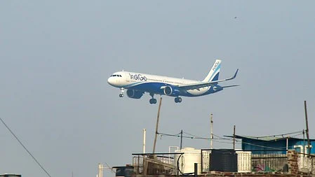 An aircraft descends for landing at Delhi airport.