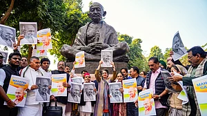 Opposition MPs protest near the statue of Mahatma Gandhi against the VB-G RAM G Bill, 16 Dec