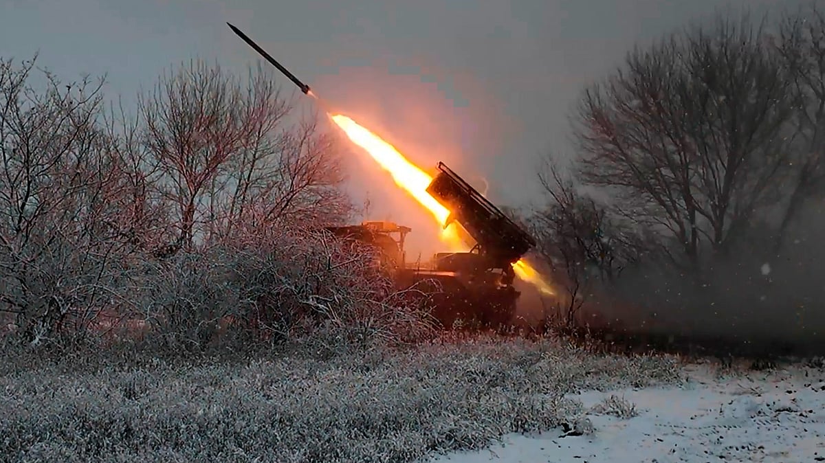 A Russian Grad multiple rocket launcher fires toward Ukrainian positions.