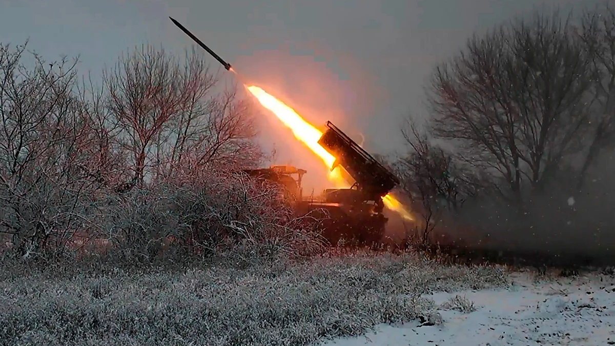 A Russian Grad multiple rocket launcher fires toward Ukrainian positions.