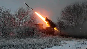A Russian Grad multiple rocket launcher fires toward Ukrainian positions.