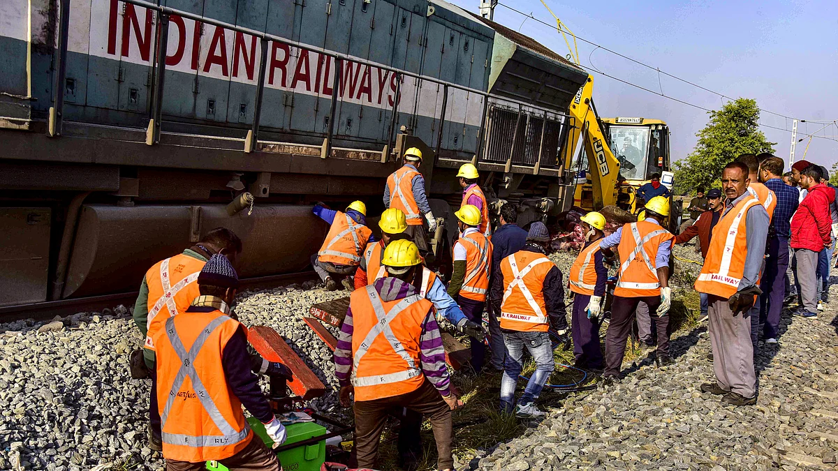 Railway workers carry out urgent restoration work in Assam’s Nagaon district.