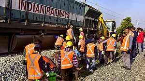 Railway workers carry out urgent restoration work in Assam’s Nagaon district.