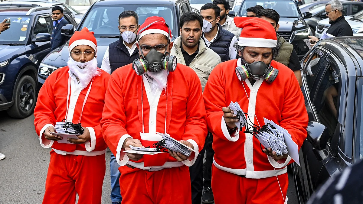 NSUI members don Santa Claus attire to protest Delhi’s worsening air pollution.