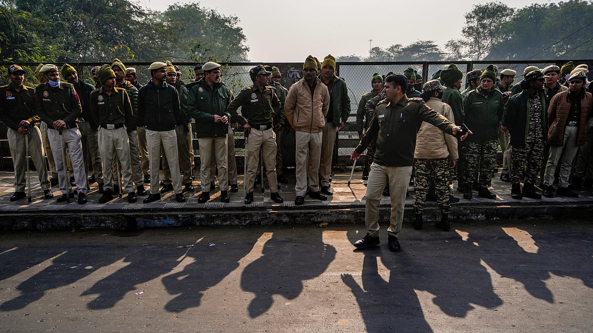 Police stand guard near the Bangladesh High Commission in New Delhi, 23 Dec