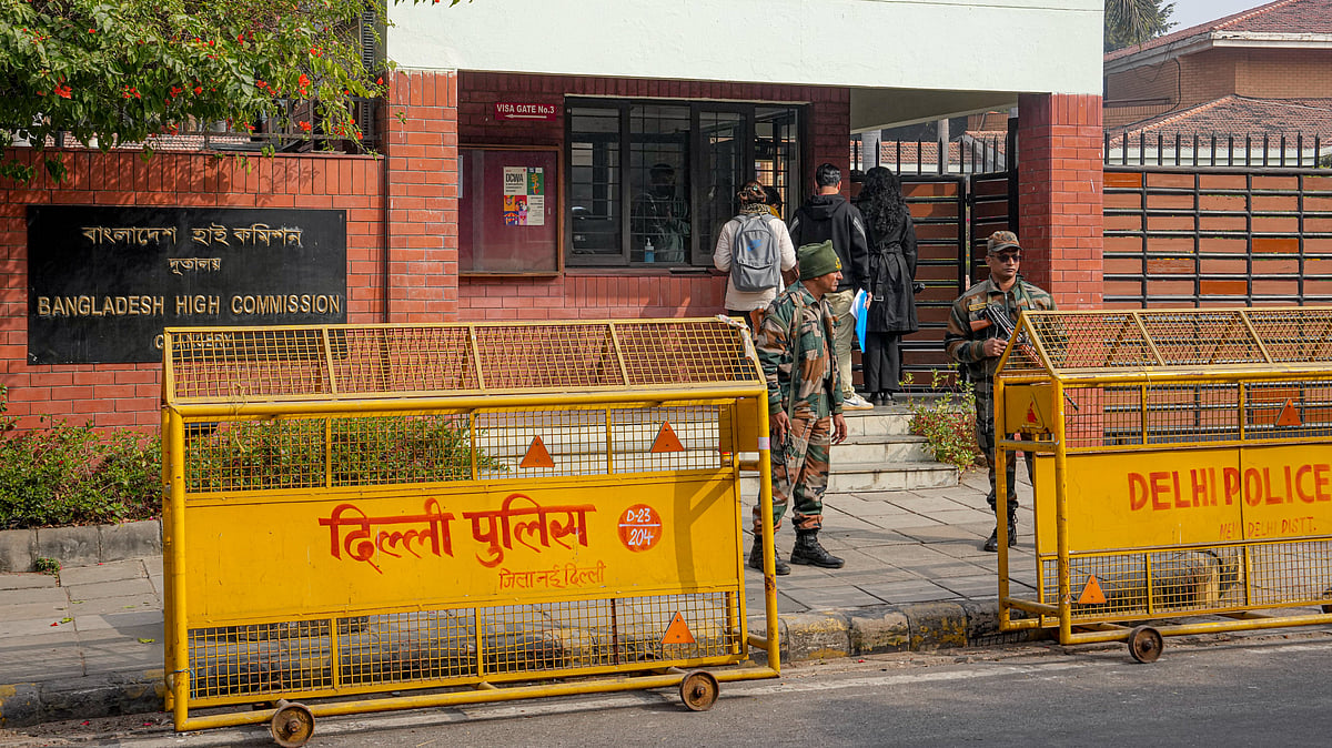 Security personnel stand guard outside the Bangladesh High Commission in New Delhi.
