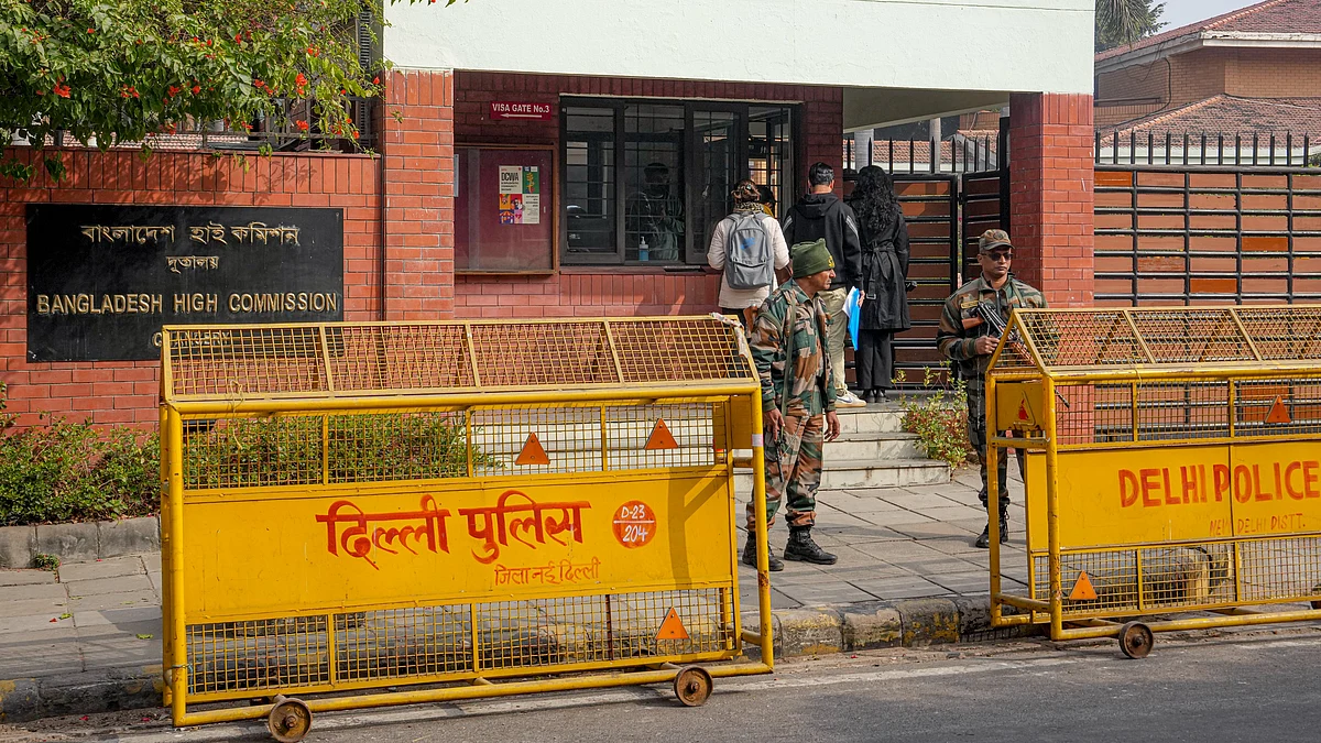 Security personnel stand guard outside the Bangladesh High Commission in New Delhi.