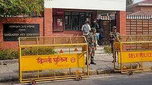 Security personnel stand guard outside the Bangladesh High Commission in New Delhi.
