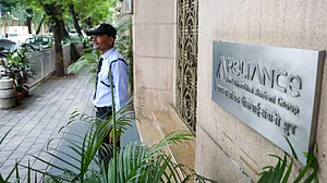 A security guard stands outside Anil Ambani's office in Mumbai. (File photo: IANS)