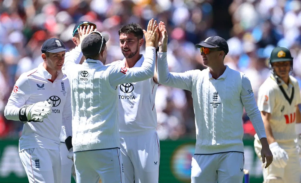 Josh Tongue, Player of the Match, being greeted by teammates after a scalp