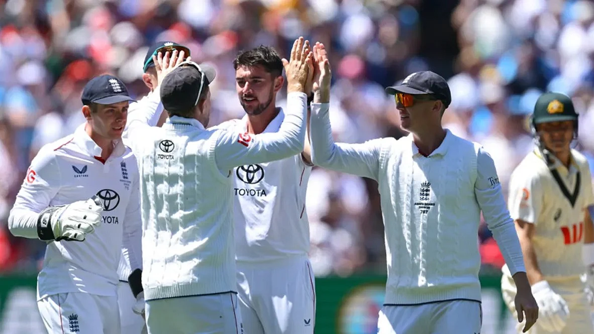 Josh Tongue, Player of the Match, being greeted by teammates after a scalp
