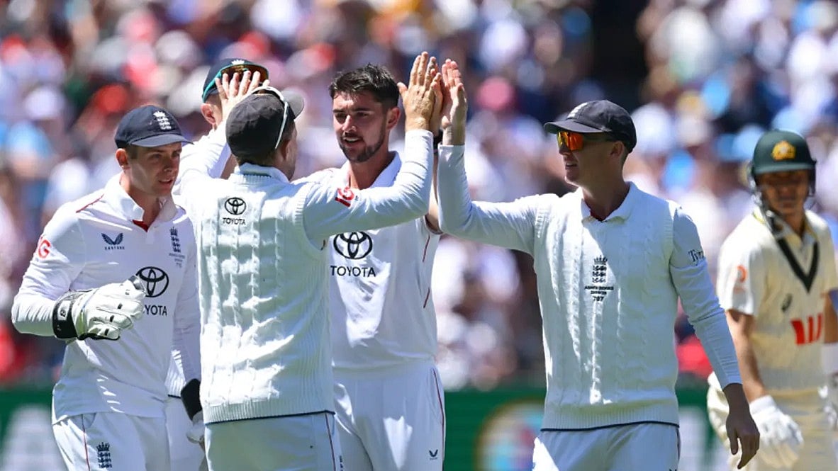 Josh Tongue, Player of the Match, being greeted by teammates after a scalp
