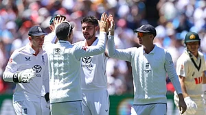 Josh Tongue, Player of the Match, being greeted by teammates after a scalp