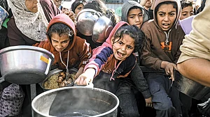 Scrabbling for food aid in Palestine