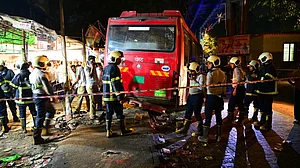 Officials inspect the site of the tragic Mumbai bus accident in Bhandup.