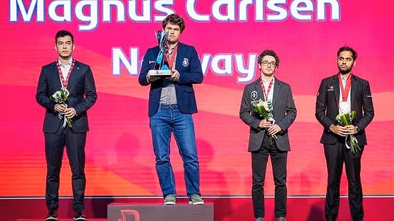 Arjun Erigaisi (right) shares the podium with winner Carlsen and silver medallist Abdusattorov